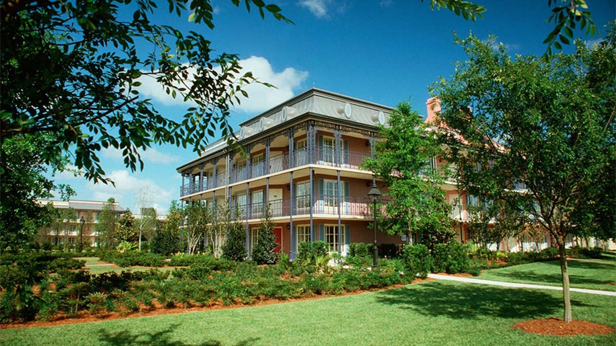 ground view of lawn and exterior of Disney's Port Orleans Resort in Orlando, Florida, USA